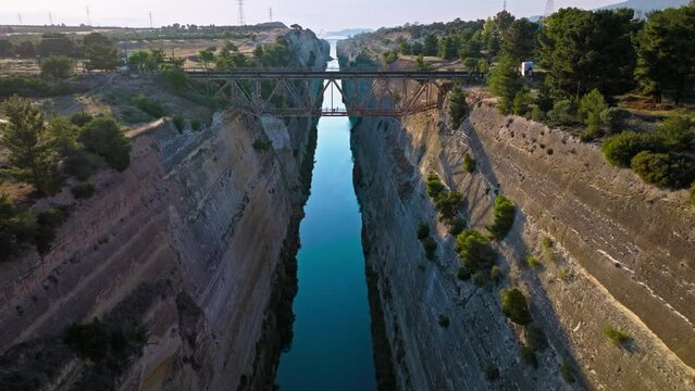 Aerial view of The Corinth Canal in Greece an international maritime hub. An artificial waterway built in Greece connects the Gulf of Corinth with the Aegean Sea.