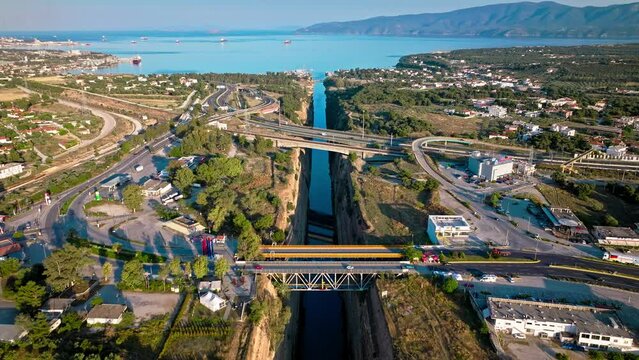 Aerial view of The Corinth Canal in Greece an international maritime hub. An artificial waterway built in Greece connects the Gulf of Corinth with the Aegean Sea.