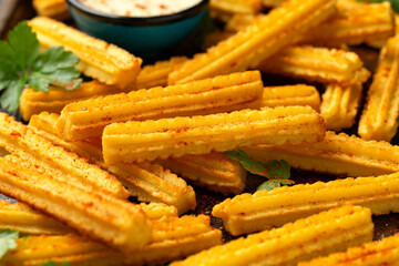 Crisp and golden Potato churros served with paprika and fresh parsley