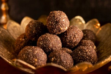 Discover the decadence of chocolate laddus in this HD image. Perfect for confectionery ads, festive...
