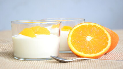 Orange cream, dessert, delicious fruity cream with oranges in a glass, isolated, dessert winter