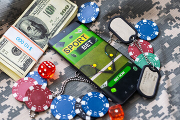 game chips with a column of bucks of dollars laid out after the game. Poker concept