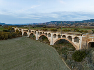 Old bridge with railroad tracks, and mountains for background 3