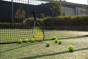 Leeds UK May 24 2016 Tennis ball and racket on a hard court with coloured filter applied during...