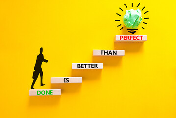 Done is better than perfect symbol. Concept words Done is better than perfect on wooden blocks....
