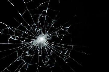 Fototapeta premium Photo of broken glass on a black background, cracks.