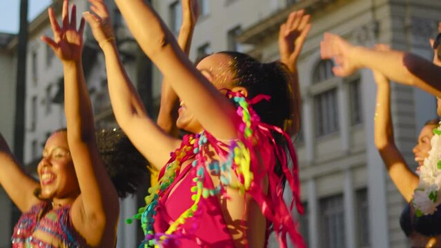 Carnival Celebration: Friends Dancing in the Streets During Festive Brazilian Party, Colorful Costumes and Joyful Expressions in Urban Brazil.