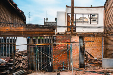 Deconstruction of old wooden house. Demolish old wooden houses in Asian styles shophouses to...