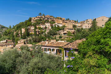 Stunning cityscape of the small coastal village of Deia in Mallorca, Spain. Traditional houses...