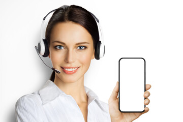 Customer support phone operator in headset hold showing smartphone cell phone mobile white blank...