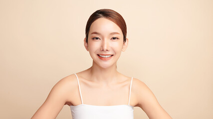 Beautiful young asian woman with clean fresh skin on beige background, Face care, Facial treatment, Cosmetology, beauty and spa, Asian women portrait.