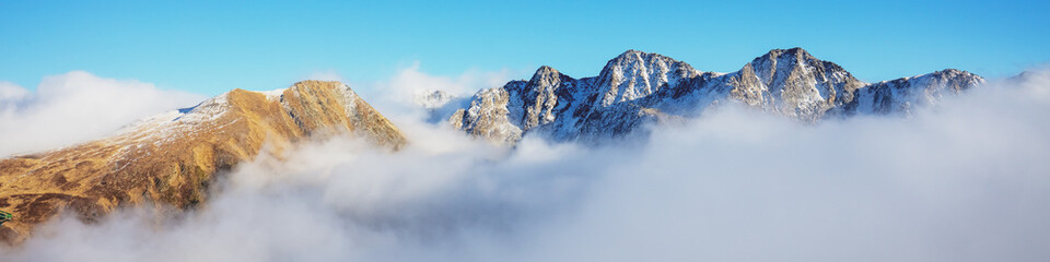 Mountains minimalist landscape. Peaks of the mountains above the clouds. Pyrenees, Andorra, Europe....