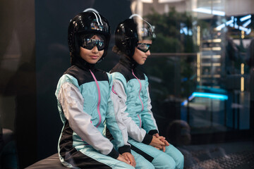 wind tunnel and a teenage girl in a helmet