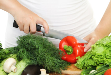 Woman's hands cutting vegetables