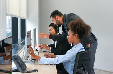 young businessman call center staff give advice to technician employee,multiracial operator agents are answering phone online in modern office