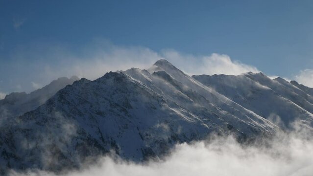 panorama mountain peaks in sun with wind and dust