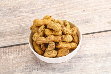 Raw ripe unpeeled peanut heap