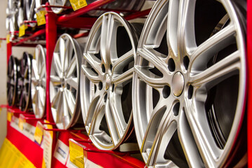 Rack with new car rims. close-up.