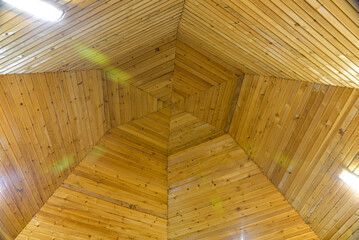 The ceiling of the yurt, sheathed with pine wood.