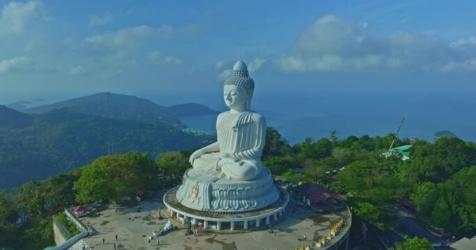 aerial photography Phuket Big Buddha was completely obscured by a blue sky..Big Buddha is one of the revered landmarks on the island..white cloud in blue sky, blue sea and mountain background..