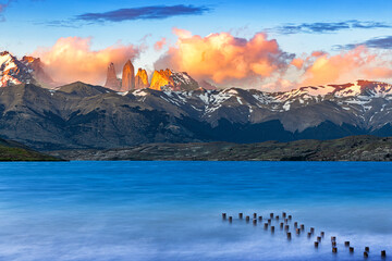 Torres del paine during sunrise with lake in foreground 