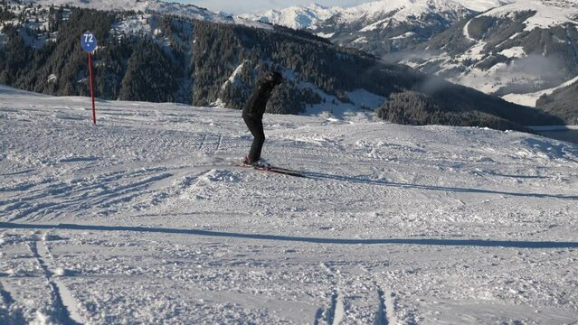 adult skiers does excersises in ski group lesson