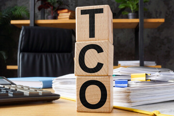Cubes with abbreviation TCO Total Cost of Ownership. - obrazy, fototapety, plakaty