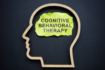 Outline of the head and inscription Cognitive behavioral therapy CBT on a piece of paper. - obrazy, fototapety, plakaty