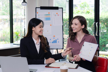 Businesswoman Consulting meeting working and brainstorming new business project finance investment concept. Business team analyzing income charts and graphs.