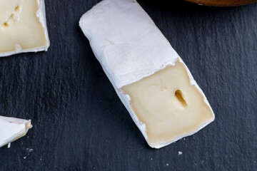 pieces of cream cheese with white mold