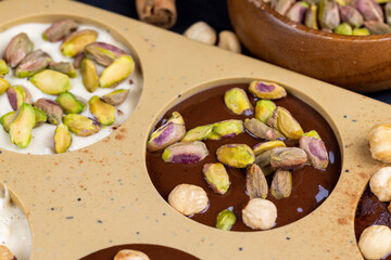 making homemade chocolate with different ingredients