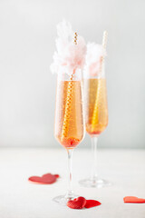 Two glasses with tasty cotton candy cocktail on light background. Valentines day alcohol drink...