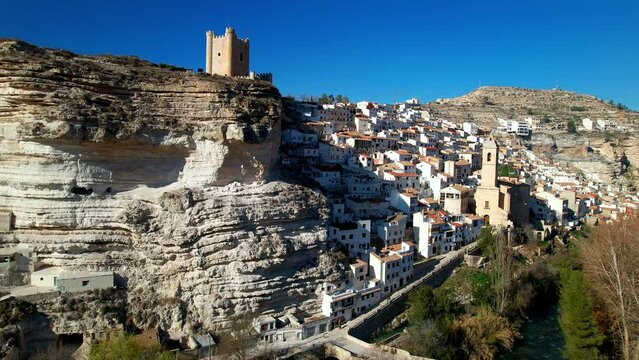 Spain, Alcala de Jucar - scenic  medieval village located in the rocks. Aerial drone high angle view with the castle and bridge