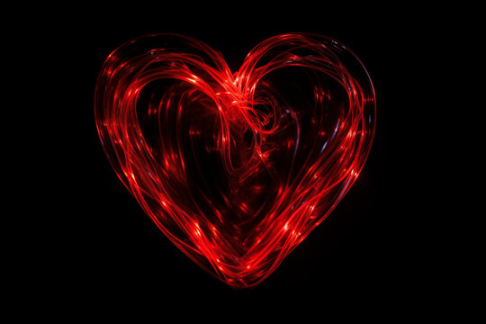 Glowing Passion: Big Red Neon Heart Illuminates the Night on a Sleek Black Canvas
