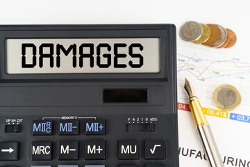 On the table are financial reports, coins and a calculator with the inscription - damages