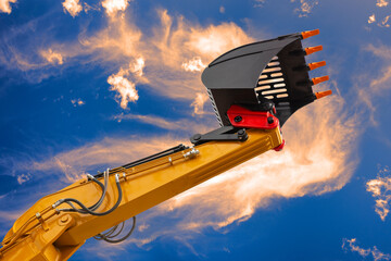 excavator is in work and digging at construction site