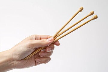 A person holding a pair of chopsticks. Generative AI