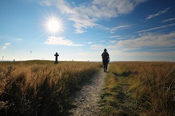 A person walking on a dirt path in a field with a cross in the background Generative AI