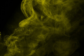 Yellow steam on a black background.