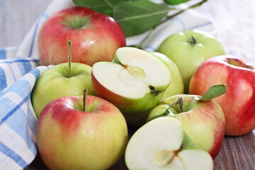 Red and green apples with leaves