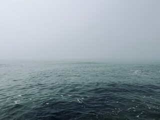 Obraz premium Foggy sea horizon, mist at the sea, mysterious seascape 