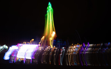An abstract image of motion blurred lights of Blackpool Tower - 701418470