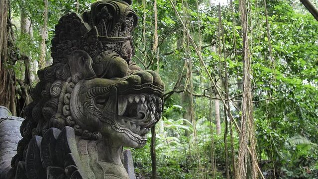 Hd slow motion footage of balinese god statue in Monkey forest, Ubud, Bali, Indonesia.
Mid angle, parallax movement.