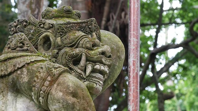 Hd slow motion footage of balinese god statue in Monkey forest, Ubud, Bali, Indonesia.
Mid angle, parallax movement.