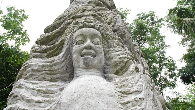 Hd slow motion footage of balinese god statue in Monkey forest, Ubud, Bali, Indonesia.
High angle, parallax movement.