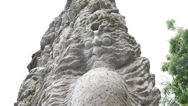 Hd slow motion footage of balinese god statue in Monkey forest, Ubud, Bali, Indonesia.
High angle, parallax movement.