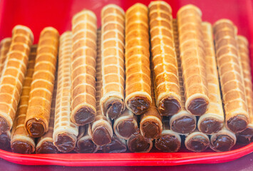 Wafer rolls filled with caramel