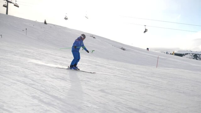Ski teacher skis short turns in lesson