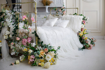 bright bed with flowers and decor