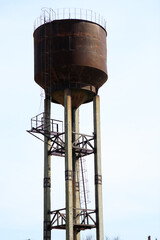  a large water tower on the background of the sky